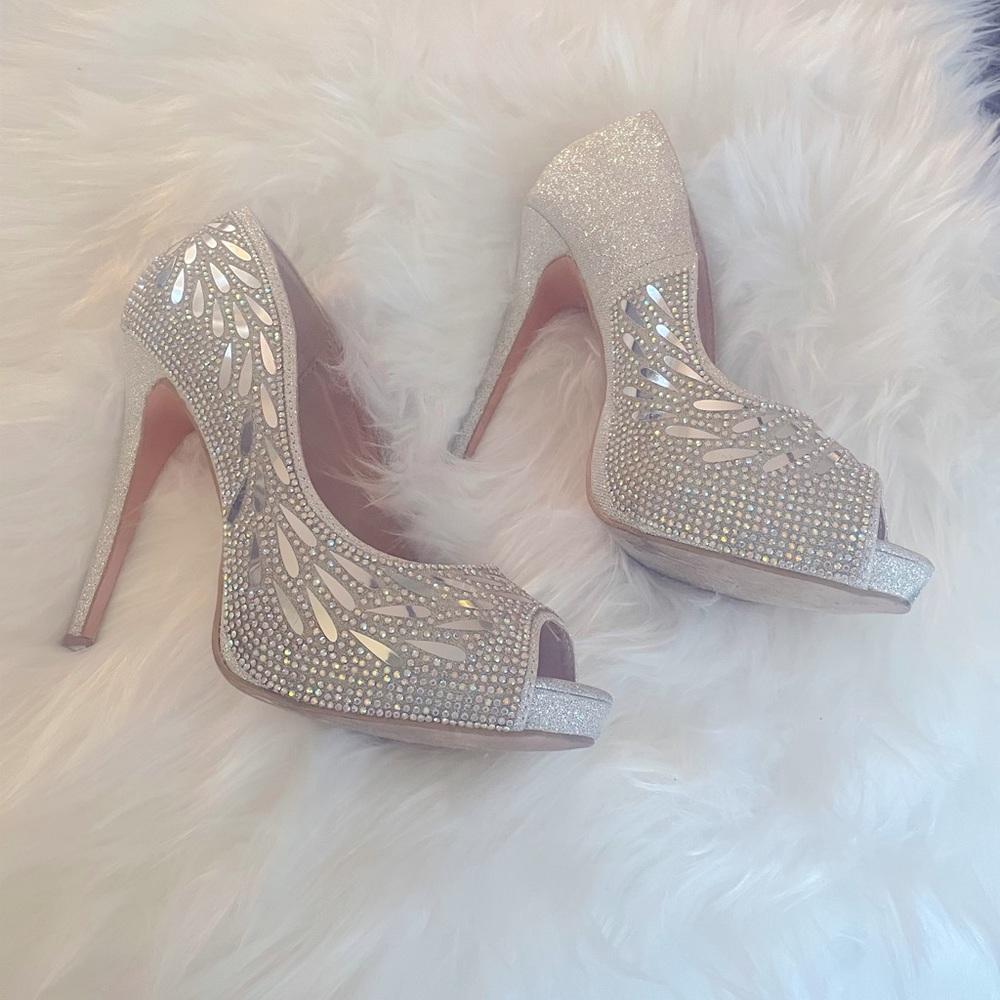 Gently worn Beautiful silver Bling stilettos!! Cindy brand-size 9 and a half.